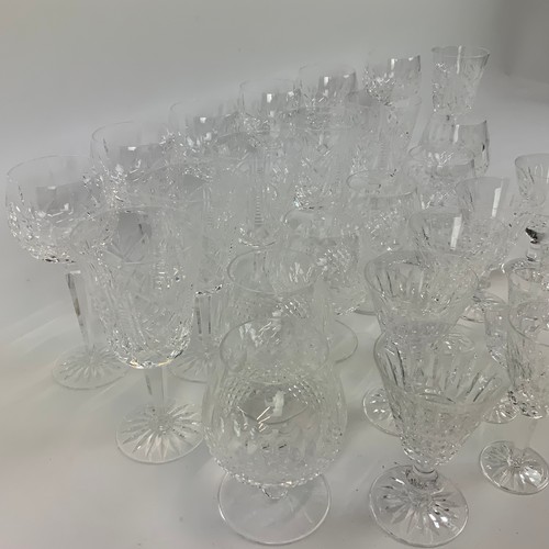 664 - A collection of 29 Waterford crystal glasses, to include tumblers, sherry glasses, wine glasses and ... 