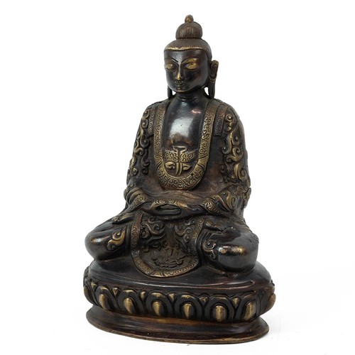 684 - A Tibetan bronze Buddha seated in meditation pose on a lotus throne base, H 20cm.