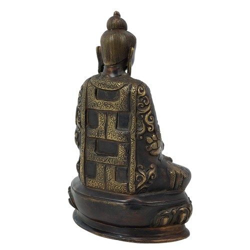 684 - A Tibetan bronze Buddha seated in meditation pose on a lotus throne base, H 20cm.