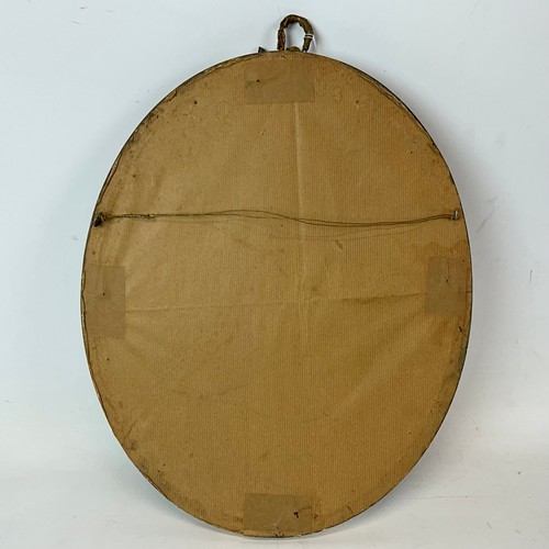 700 - A 19th century charcoal drawing of a lady, in oval plaster and gilt frame, with ribbon finial, unsig... 