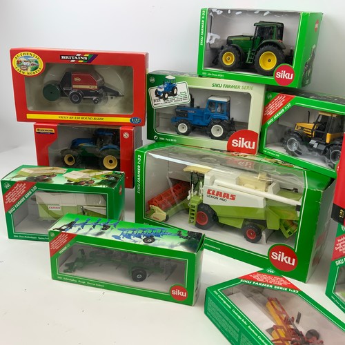 757 - A collection of die-cast boxed farm models, including Britains and SKIU, as well as New Holland, Joh... 