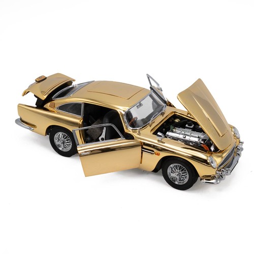 777 - Danbury Mint, a gold special edition James Bond Aston Martin DB5 007,  with a certificate of authent... 
