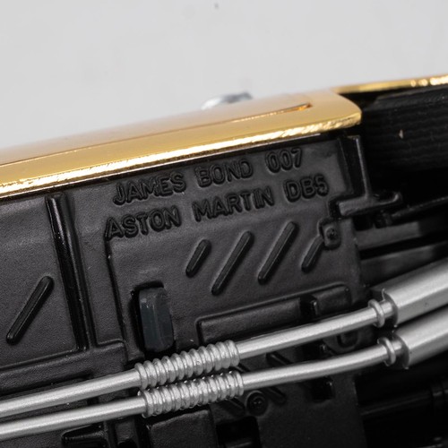 777 - Danbury Mint, a gold special edition James Bond Aston Martin DB5 007,  with a certificate of authent... 