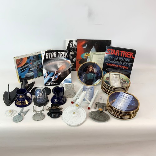 783 - A collection of Star Trek-related items, including Enterprise plates, models and other items.
