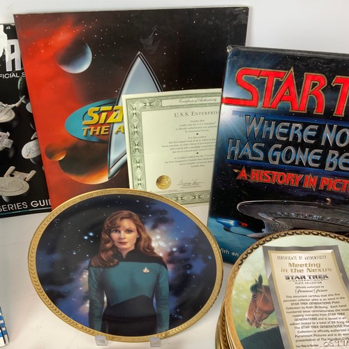 783 - A collection of Star Trek-related items, including Enterprise plates, models and other items.