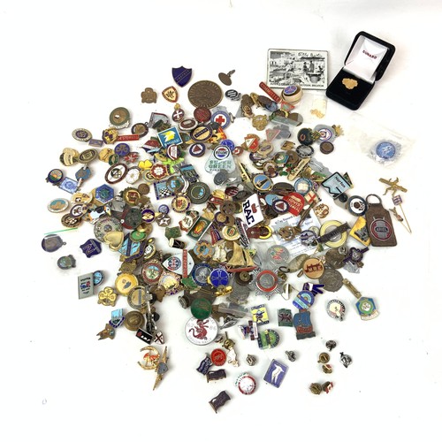 828 - A large collection of vintage enamel badges, including Butlins, advertising, motoring and others.
