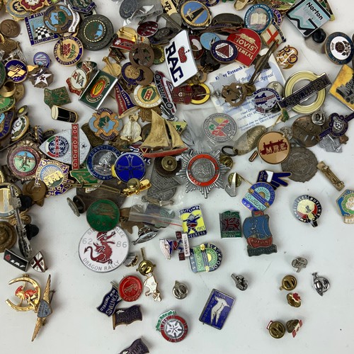 828 - A large collection of vintage enamel badges, including Butlins, advertising, motoring and others.