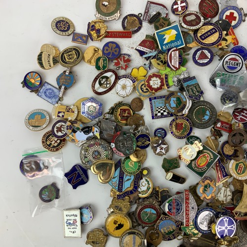 828 - A large collection of vintage enamel badges, including Butlins, advertising, motoring and others.