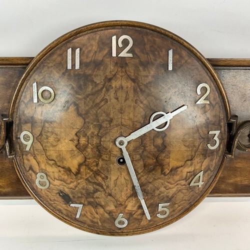 An Art Deco-style oak and walnut wall clock with chrome Arabic numeral ...