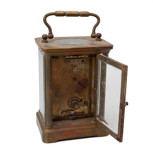 881 - A vintage brass carriage clock with bevelled glass sides, a white enamel face with Roman numeral inc... 