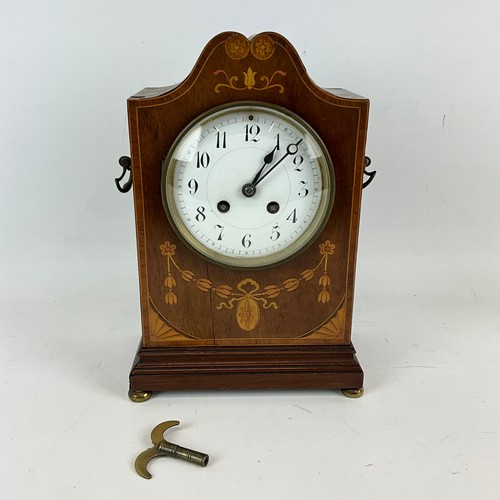 882 - Two chiming mantle clocks, an Edwardian eight day marquetry inlaid mahogany cased with white dial an... 