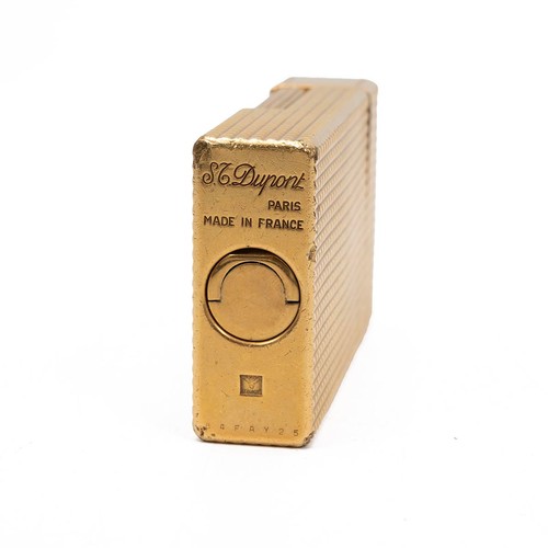 883 - St Dupont Paris; A gold plated Dupont pocket lighter, with hobnail patter to the case (working)