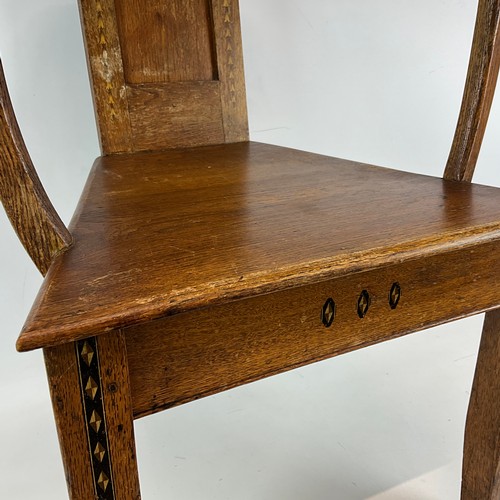 900 - A 1922 Eisteddfod chair with fruitwood inlay to legs and back, bowed arm rests with gilt writing dat... 