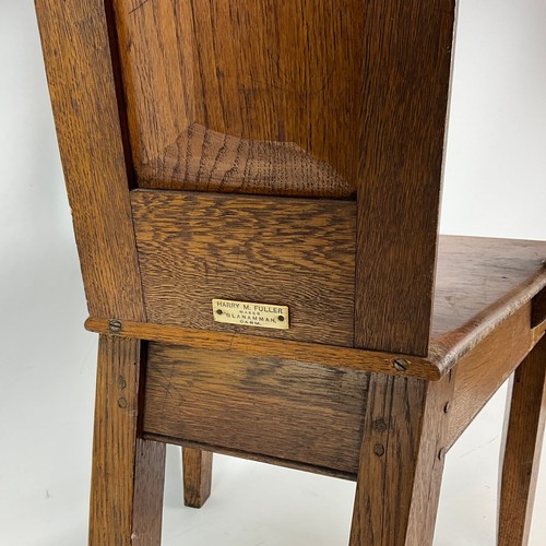 900 - A 1922 Eisteddfod chair with fruitwood inlay to legs and back, bowed arm rests with gilt writing dat... 
