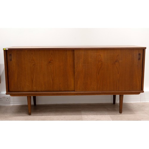901 - A Danish design G-Plan style mid-20th-century teak sideboard with two sliding doors, enclosing two i... 