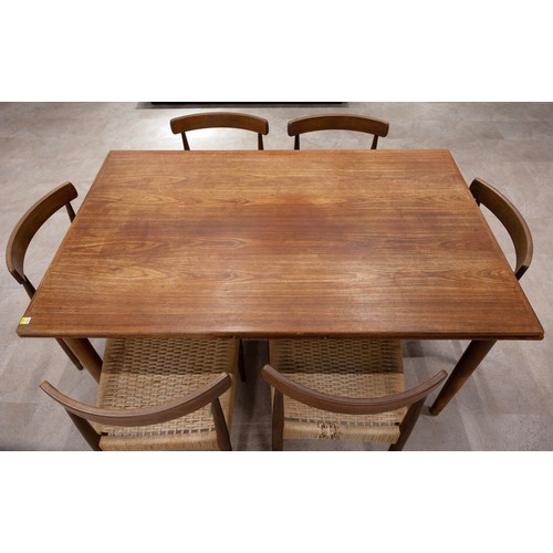 902 - A G-plan style Danish teak drawer leaf dining table of rectangular form, raised on four turned taper... 