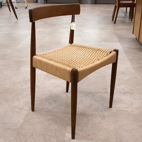 902 - A G-plan style Danish teak drawer leaf dining table of rectangular form, raised on four turned taper... 