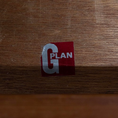 917 - A G-plan teak headboard with padded irredecent fabric with attached single drawer bedside cabinets, ... 