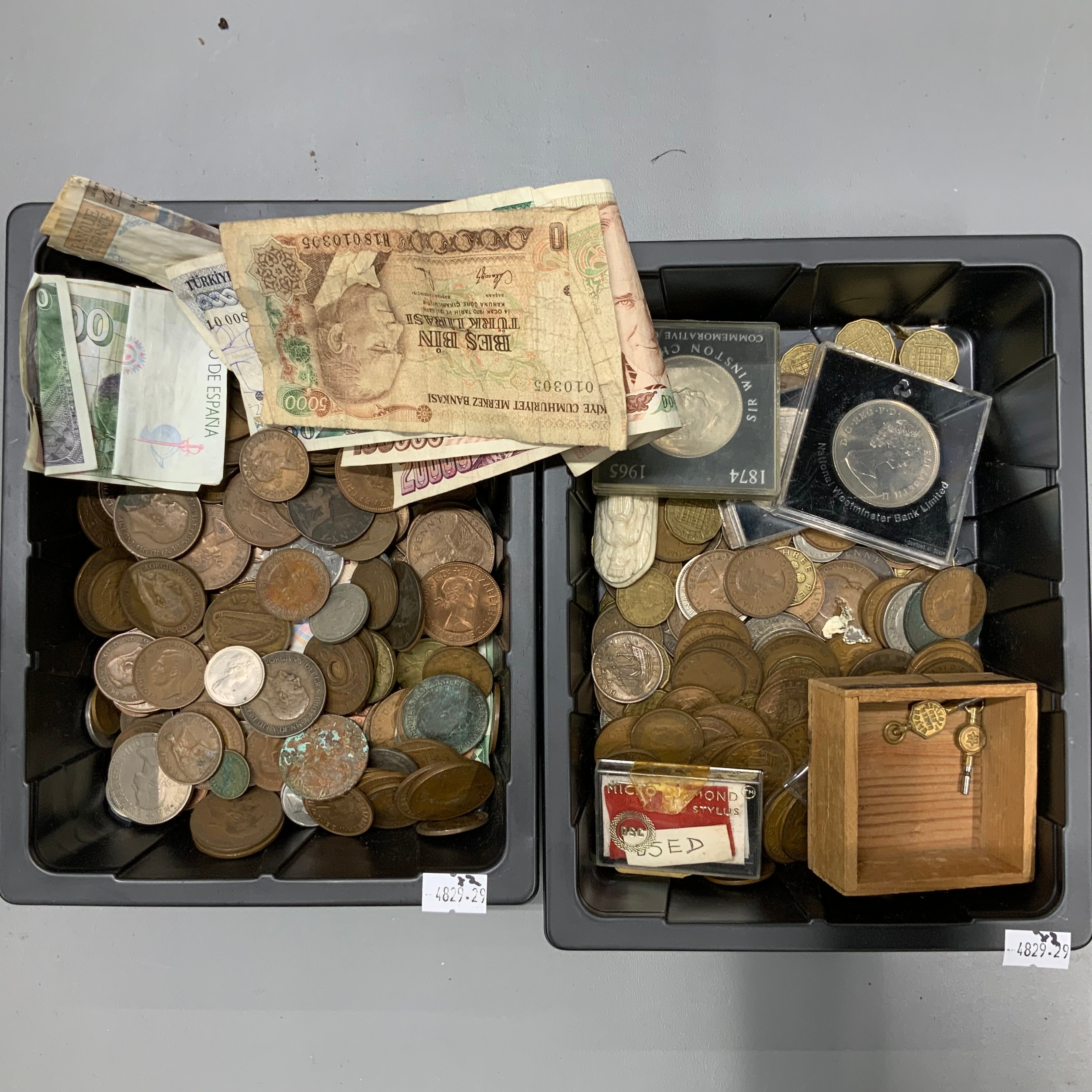Collection of coins and notes and other items.