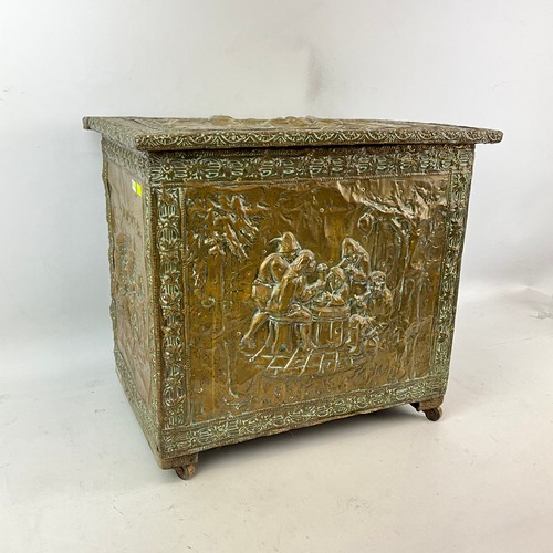 16 - A 20th-century copper log bin, decorated with various figures seated around a table.