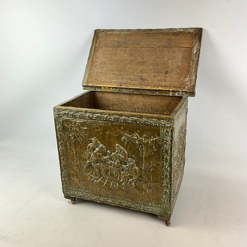 16 - A 20th-century copper log bin, decorated with various figures seated around a table.