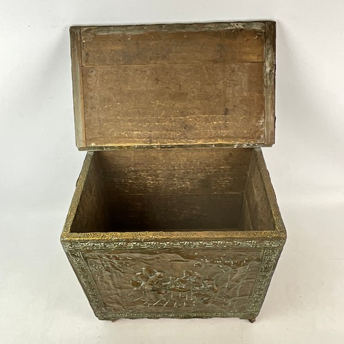 16 - A 20th-century copper log bin, decorated with various figures seated around a table.
