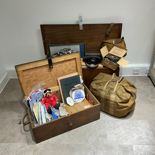 19 - A collection of militaria, to include a gas mask, canvas bags, an RAF officer's hat by Herbert Johns... 