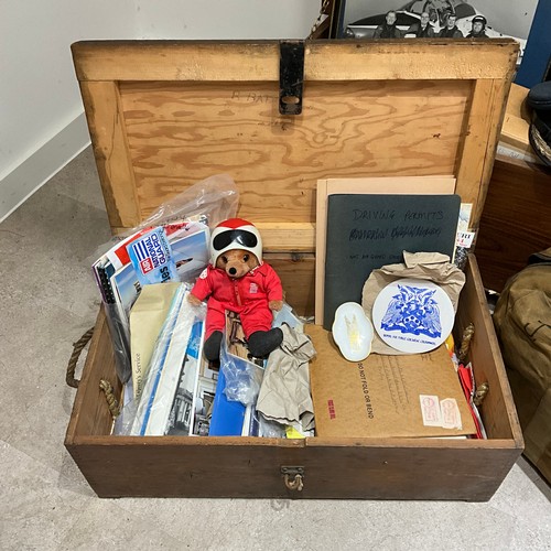 19 - A collection of militaria, to include a gas mask, canvas bags, an RAF officer's hat by Herbert Johns... 