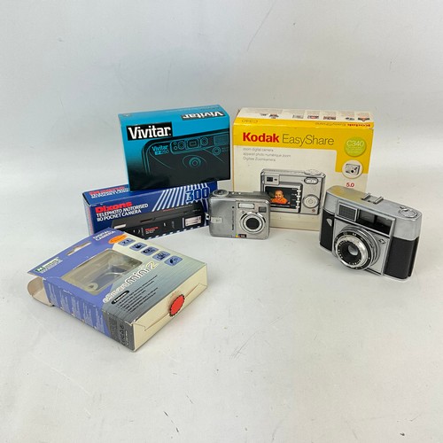 54 - A collection of cameras to include a digital Kodak example, a Mustek G-smart Mini 2, Dixons Telephot... 