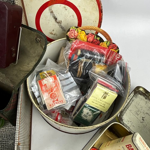 57 - A collection of sewing items, along with vintage medication tins, shaving kit, advertising boxes and... 