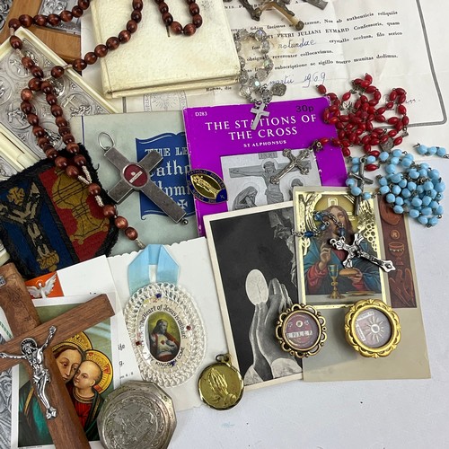 21 - A collection of religious items to include Holy Relic of St Pius X with Certificate of Authenticity,... 
