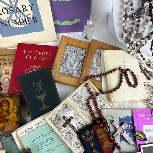 21 - A collection of religious items to include Holy Relic of St Pius X with Certificate of Authenticity,... 