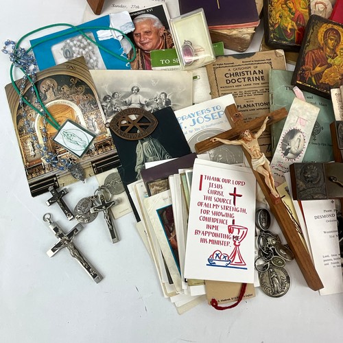 21 - A collection of religious items to include Holy Relic of St Pius X with Certificate of Authenticity,... 