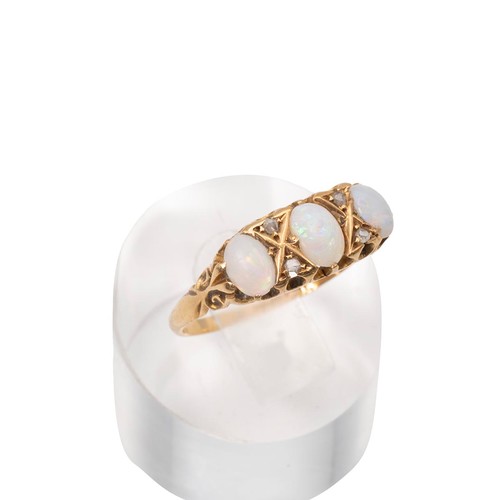 3 - An 18ct gold, three stone opal and diamond ring, the opals displaying a range of colours, set in a d... 