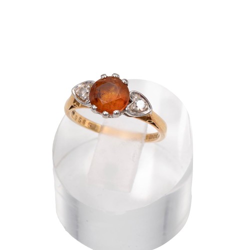 7 - An 18ct gold dress ring with a central citrine flanked by two diamonds in heart-shaped mounts, size ... 