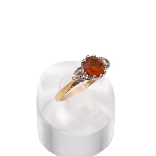 7 - An 18ct gold dress ring with a central citrine flanked by two diamonds in heart-shaped mounts, size ... 