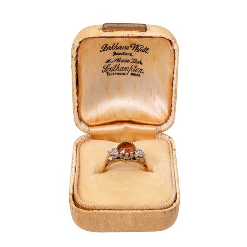 7 - An 18ct gold dress ring with a central citrine flanked by two diamonds in heart-shaped mounts, size ... 