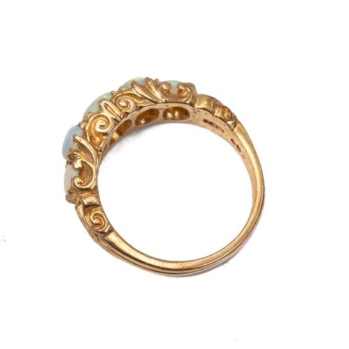 15 - A 9ct gold five stone opal ring, the opals of graduating oval form displaying a full range of colour... 