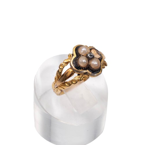 23 - An 18ct (tested) gold mourning ring set with four seed pearls (one missing) and a central rose cut d... 