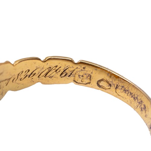 23 - An 18ct (tested) gold mourning ring set with four seed pearls (one missing) and a central rose cut d... 