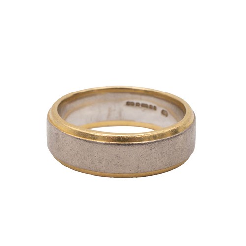 26 - An 18ct hallmarked yellow and white gold wedding band size P, weight 9.8 grams.
