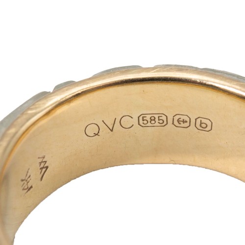 29 - A carved jade 14ct gold ring with carved decoration size N, weight 4.1 grams.