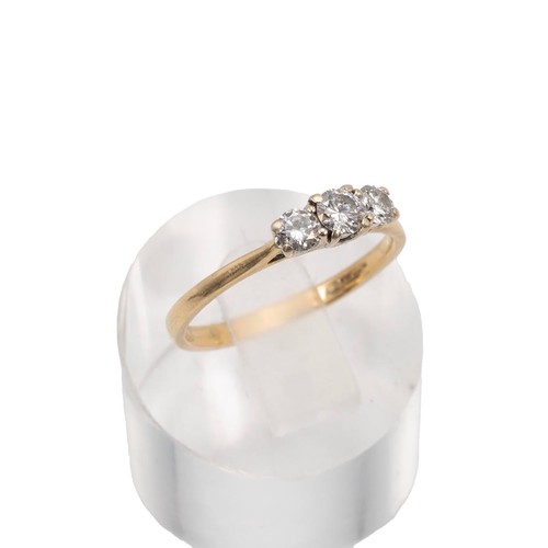 37 - 18ct gold hallmarked three stone diamond ring. The central brilliant cut diamond, approx 0.15ct, fla... 