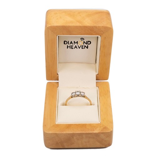 37 - 18ct gold hallmarked three stone diamond ring. The central brilliant cut diamond, approx 0.15ct, fla... 