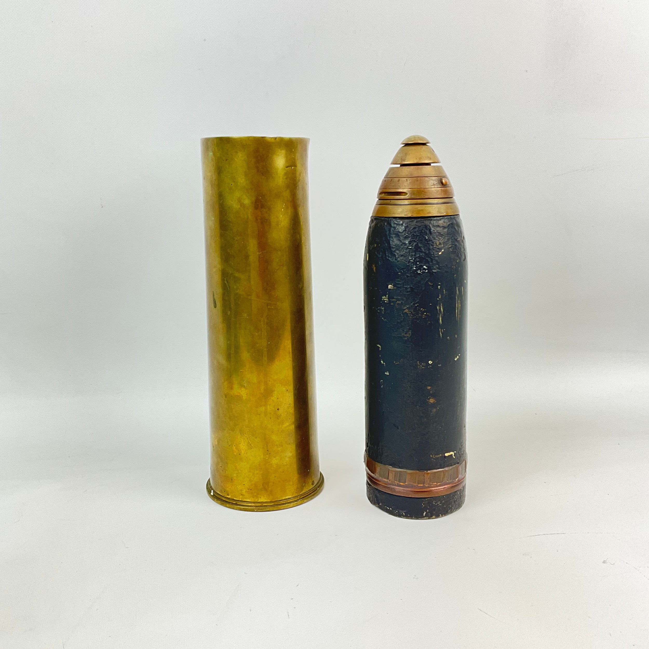 A WWI timed artillery shrapnel projectile and shell, with the shell ...