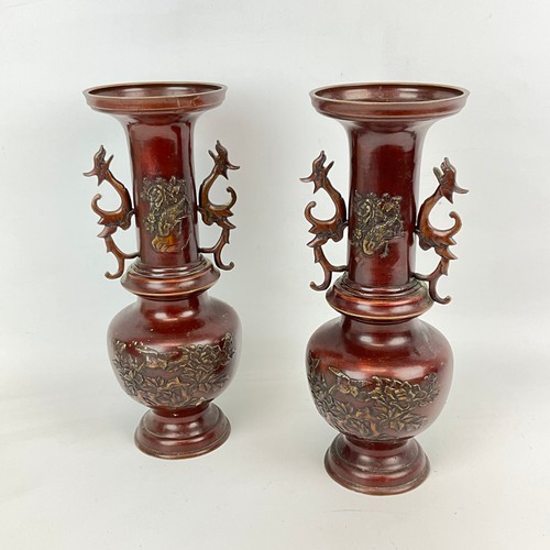 215 - A pair of Japanese bronze vases, late 19th-century, early 20th-century, decorated with relief carvin... 