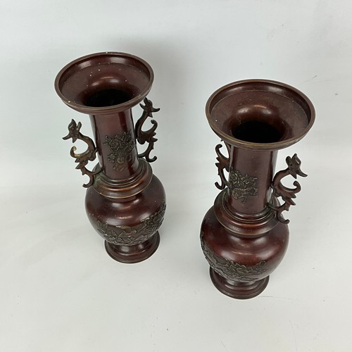 215 - A pair of Japanese bronze vases, late 19th-century, early 20th-century, decorated with relief carvin... 