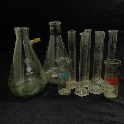 279 - A collection of vintage glass pharmaceutical jars, along with various advertising jars.