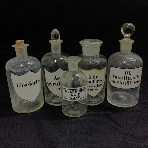 279 - A collection of vintage glass pharmaceutical jars, along with various advertising jars.