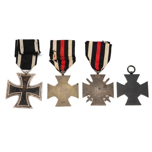 65 - A collection of WWI German medals to include an Iron Cross 2nd Class medal, an Honour Cross with swo... 